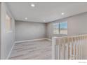 Bright living room with natural light and hardwood flooring creating a cozy atmosphere at 9525 Damon Dr, Northglenn, CO 80260