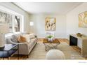 Bright living room with bay window and hardwood floors and modern decor at 1153 Atwood St, Longmont, CO 80501
