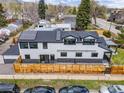 Aerial view of the home showcasing modern design, solar panels, and a fenced backyard at 1175 Evergreen Ave, Boulder, CO 80304