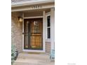 Inviting front entrance with a decorative glass door and sidelight at 13680 Fall Creek Cir, Broomfield, CO 80020