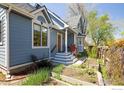 Lovely home with a charming blue exterior, welcoming porch, and landscaped garden at 1605 17Th St, Boulder, CO 80302