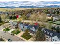 A beautiful aerial shot of the neighborhood with mountain views and proximity to trails at 2225 Clayton Cir, Superior, CO 80027