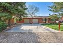 Charming single-story brick home with attached two-car garage and well-manicured front yard at 2511 Brentwood St, Lakewood, CO 80214