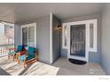 Inviting front porch with comfortable seating, perfect for relaxing and enjoying the outdoors at 2547 Concord Cir, Lafayette, CO 80026