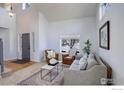 Spacious living room with vaulted ceiling, natural light, and elegant decor at 2547 Concord Cir, Lafayette, CO 80026