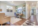 Bright office space with wood floors, neutral paint, and ample natural light at 4202 Sandstone Dr, Mead, CO 80504