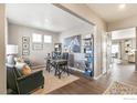 Stylish office space with a modern desk, shelving, and a unique horse art piece at 4202 Sandstone Dr, Mead, CO 80504