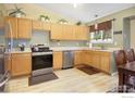 Well-equipped kitchen with stainless steel appliances and ample counter space and natural lighting at 4820 W 125Th Ave, Broomfield, CO 80020