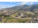 Expansive aerial view showcasing the property's location nestled in a scenic neighborhood with mountain views at 726 Mourning Dove Ln, Golden, CO 80401