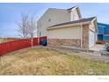 Backyard view showing fenced yard space perfect for outdoor activities at 10635 E 96Th Pl, Commerce City, CO 80022