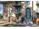 Condo building entrance with balconies and a secure entryway at 12102 Melody Dr # 103, Denver, CO 80234