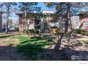 This condo building has an attractive exterior and landscaped grounds at 12102 Melody Dr # 103, Denver, CO 80234