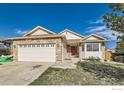 Charming single-Gathering home with stone accents, a red front door, and a well-maintained lawn at 13960 Grape St, Thornton, CO 80602