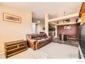 Spacious living room with an open layout, neutral walls, and unique furnishings at 13960 Grape St, Thornton, CO 80602