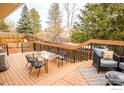 Inviting outdoor deck area with seating, perfect for entertaining or relaxing while enjoying the serene backyard views at 1504 Washington Ave, Louisville, CO 80027
