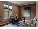 Cozy office space with hardwood floors, a large window, and comfortable seating with ample workspace at 2353 S Juniper Way, Lakewood, CO 80228