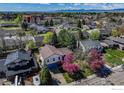 A high angle shot shows mature trees and landscaping within a residential neighborhood at 2417 15Th Ave, Longmont, CO 80503