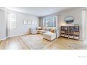 Bright living room features a comfortable sectional sofa, stylish rug, and abundant natural light at 3196 Park St, Mead, CO 80542