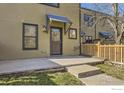 Charming front entrance with a covered doorway, concrete steps, and well-kept landscaping at 3215 Foundry Pl # 106N, Boulder, CO 80301