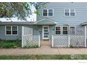 Charming home exterior featuring a quaint entrance with a white lattice fence at 3390 34Th St # B, Boulder, CO 80301