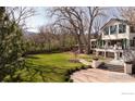 Large backyard with lush lawn and landscaped area with easy access to the house via patio at 3633 21St St, Boulder, CO 80304