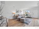 Open-concept living room with modern furnishings, natural light, and hardwood floors at 3770 Iris Ave # B, Boulder, CO 80301