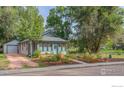 Charming home with tidy landscaping and a detached garage, set back from the street for added privacy at 42 Marshall Pl, Longmont, CO 80504