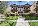 Stately brick home with a manicured front lawn, mature trees and covered front porch at 930 N Humboldt St # 4, Denver, CO 80218