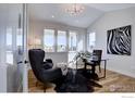 Inviting office with a glass desk, comfortable seating, and an abundance of natural light at 1041 Turnberry Cir, Louisville, CO 80027