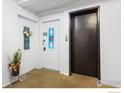 Hallway with elevator access and apartment entrances at 1350 Josephine St # 502, Denver, CO 80206