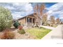 Well-maintained single-Gathering home featuring a covered porch, landscaped yard, and a two-car garage at 1358 14Th Ave, Longmont, CO 80501