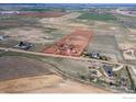 Aerial view outlining the property with home, red barn, and some neighboring homes at 1916 W County Road 6, Berthoud, CO 80513