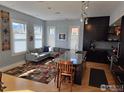 Open-concept kitchen with an island, wood floors, modern cabinets and lots of natural light at 2336 Spruce St # 5, Boulder, CO 80302