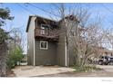 Charming two-story home featuring a wood exterior, a balcony, and a driveway at 2651 9Th St, Boulder, CO 80304
