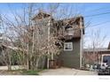 Charming two-story home featuring a wood exterior, a balcony, and a driveway at 2651 9Th St, Boulder, CO 80304