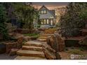 Inviting two-story home with landscaped front yard and stone pathway at 563 Arapahoe Ave, Boulder, CO 80302