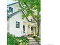 Charming home exterior with lush landscaping, stairs, and a cozy front porch, showcasing its inviting appeal at 644 Dewey Ave, Boulder, CO 80304