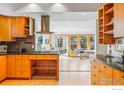 Modern kitchen with stainless steel appliances, wooden cabinets, and an open layout for easy living at 644 Dewey Ave, Boulder, CO 80304