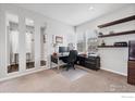 Bright office with ample natural light, built-in shelves, and an organized workspace at 6935 E 133Rd Ave, Thornton, CO 80602