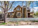 Attractive two-story home with a classic picket fence and mature trees at 700 Atwood St, Longmont, CO 80501