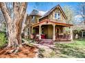 Charming two-story home with a cozy front porch perfect for relaxing at 700 Atwood St, Longmont, CO 80501
