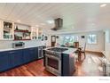 Beautiful kitchen with stainless steel appliances, large island, and modern cabinetry at 1098 Cherryvale Rd, Boulder, CO 80303