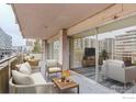 Spacious balcony featuring cozy outdoor seating, offering a relaxed retreat with city views and natural light at 1121 Albion St # 402, Denver, CO 80220