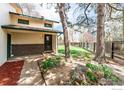 Inviting two-story home with a manicured lawn and mature trees providing shade at 1225 Centaur Cir # A, Lafayette, CO 80026