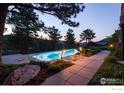 Inviting pool with lovely landscaping and mountain views, ideal for relaxing and enjoying the outdoors at 1530 Timber Ln, Boulder, CO 80304