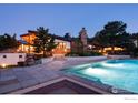 Beautiful pool with stone patio and landscaping, perfect for relaxing and entertaining in a private setting at 1530 Timber Ln, Boulder, CO 80304