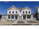 Charming townhome exteriors featuring neutral siding, covered porches, and well-maintained landscaping at 193 Liberty St, Erie, CO 80516