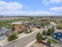 Desirable neighborhood, lush landscaping, and a serene pond view complement this residence at 2190 Coyote Creek Dr, Fort Lupton, CO 80621