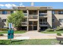 Multi-level apartment complex featuring balconies and well-maintained landscaping at 40 S Boulder Cir # 4033, Boulder, CO 80303
