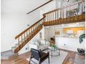 Inviting living room with hardwood floors, an open staircase, and lots of natural light at 40 S Boulder Cir # 4033, Boulder, CO 80303